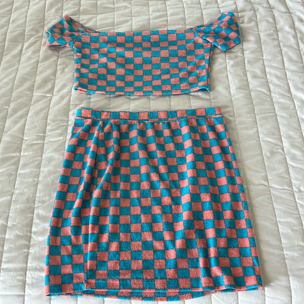 Two piece crop top and mini skirt. Fitted but stretchy material